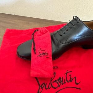 Only worn twice, men’s red bottom dress shoes.